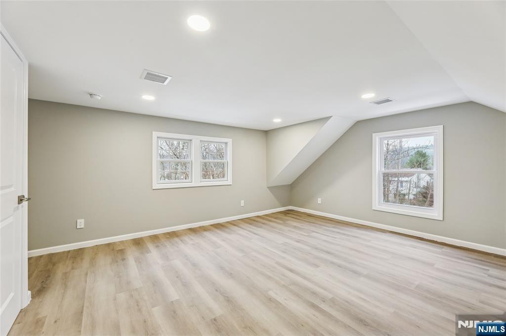 448 Morsetown Road West Milford, NJ 07480 - Photo 17 of 27 a view of an empty room with wooden floor and a window