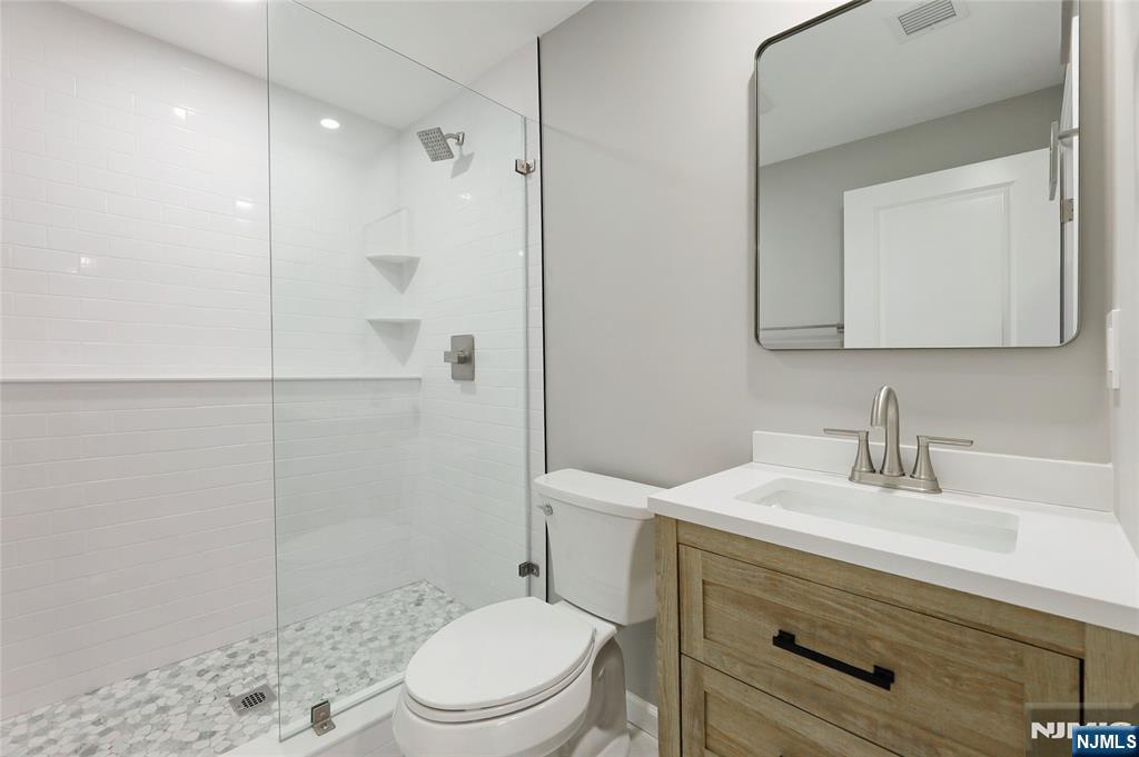 448 Morsetown Road West Milford, NJ 07480 - Photo 19 of 27 a bathroom with a sink a toilet and shower