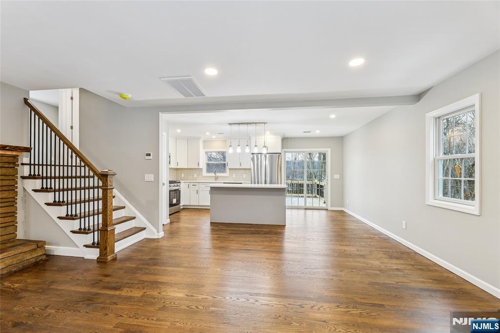 448 Morsetown Road West Milford, NJ 07480 - Photo 4 of 27 a view of an empty room with wooden floor and a window