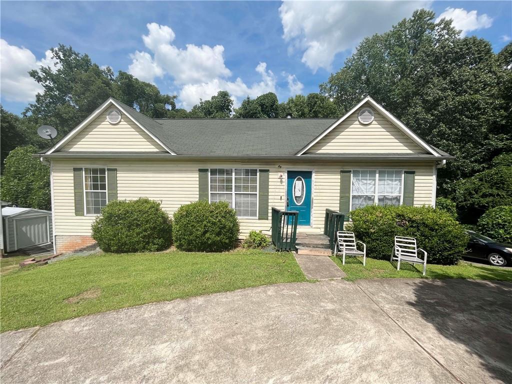 6463 Heritage Run Morrow, GA 30260 - Photo 1 of 1 a front view of a house with a yard