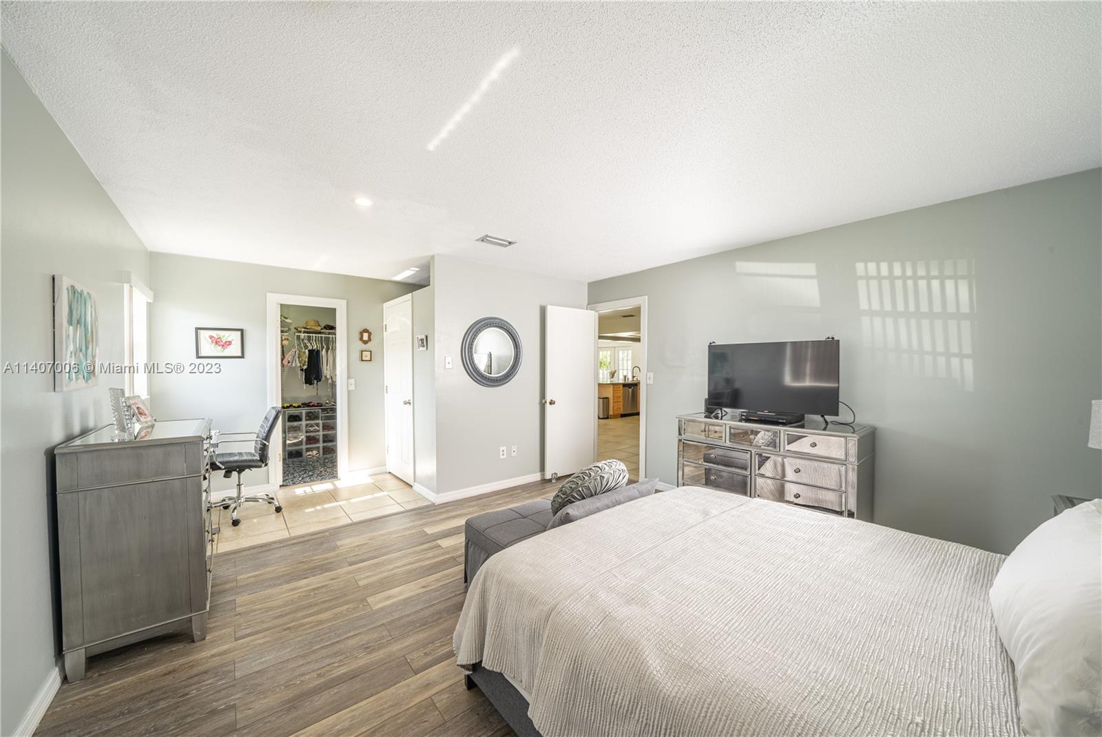 2403 Pasco Drive Sebring, FL 33870 - Photo 15 of 36 a bedroom with a bed and a flat screen tv