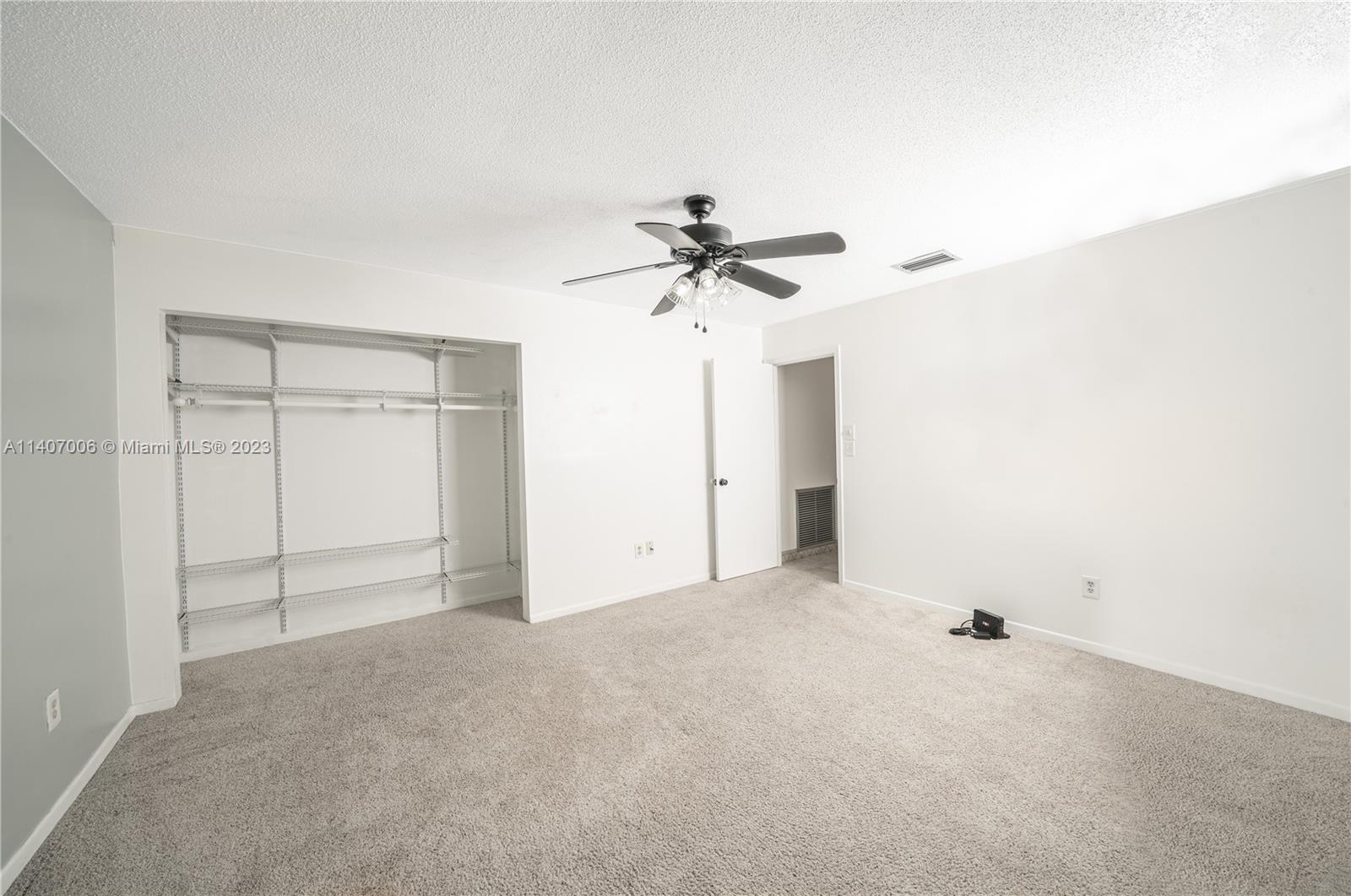 2403 Pasco Drive Sebring, FL 33870 - Photo 20 of 36 a view of a livingroom with a ceiling fan and a chandelier fan