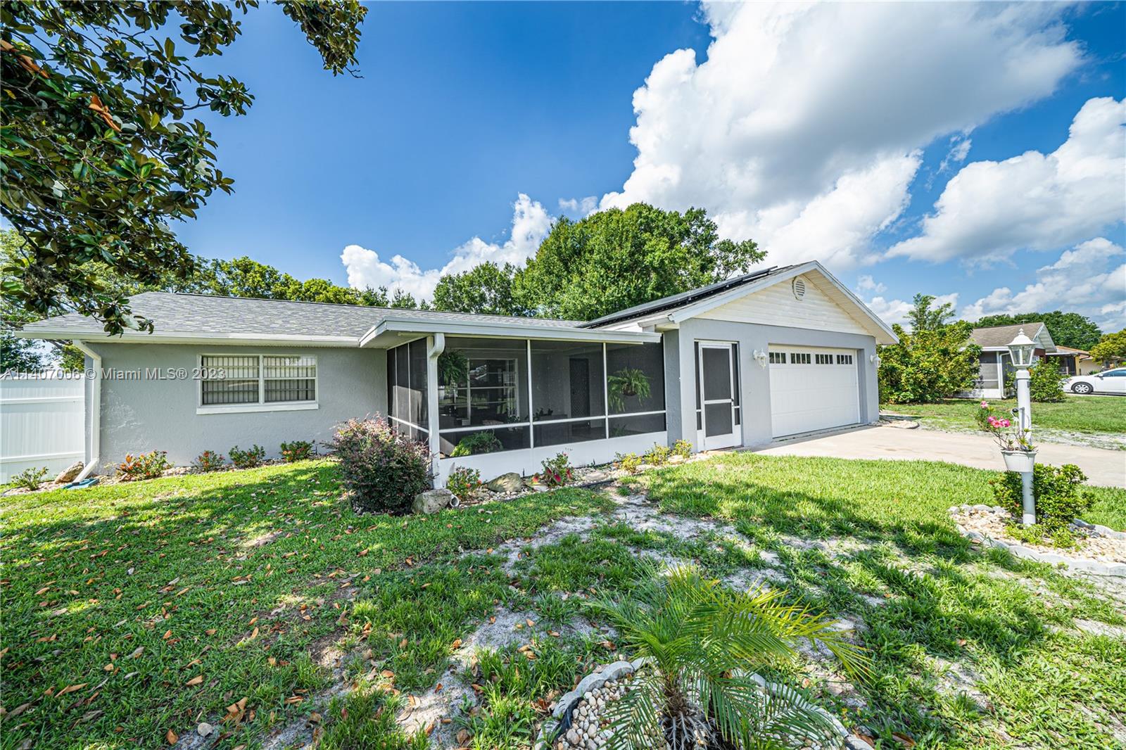 2403 Pasco Drive Sebring, FL 33870 - Photo 3 of 36 a front view of house with yard and green space