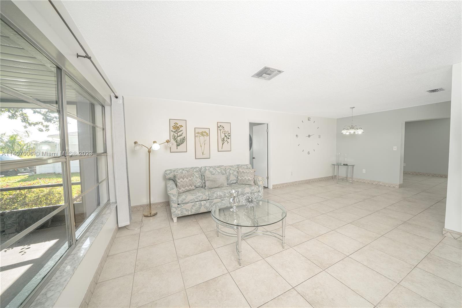 2403 Pasco Drive Sebring, FL 33870 - Photo 36 of 36 a living room with furniture and a large window