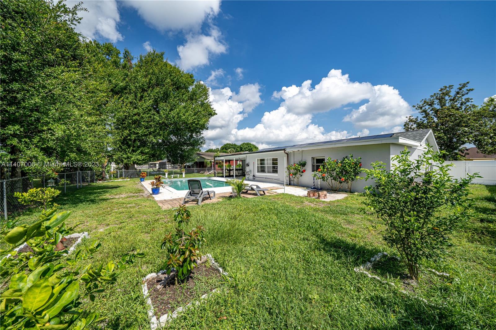 2403 Pasco Drive Sebring, FL 33870 - Photo 4 of 36 a front view of a house with garden