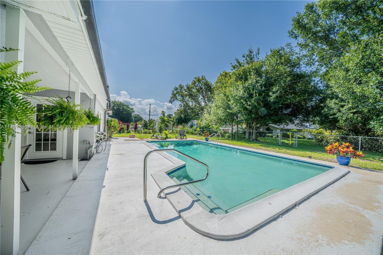 2403 Pasco Drive Sebring, FL 33870 - Photo 7 of 36 a view of swimming pool with seating space and trees in the background