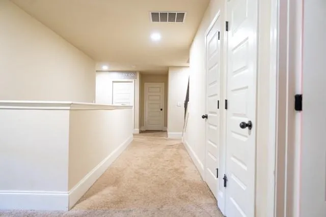 a view of a hallway with a white walls