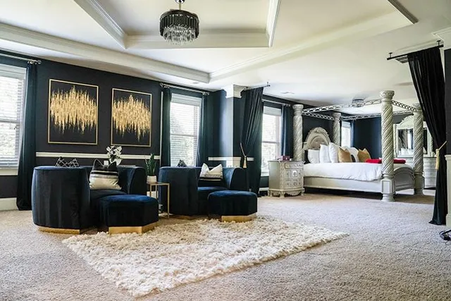 a living room with furniture gym equipment and a flat screen tv