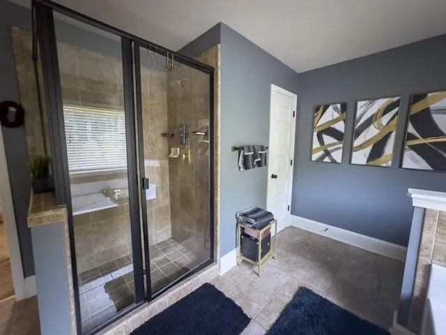 a view of an empty room and bathroom