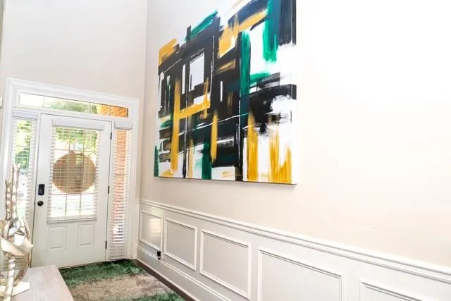 a view of an entryway with wooden floor