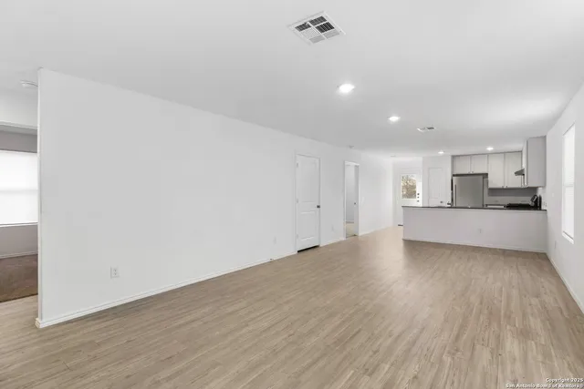 a view of a kitchen with a sink and a stove top oven