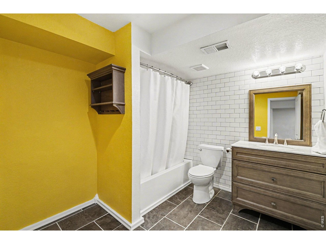 844 Cliffrose Way Severance, CO 80550 - Photo 15 of 50 a bathroom with a sink a toilet and shower