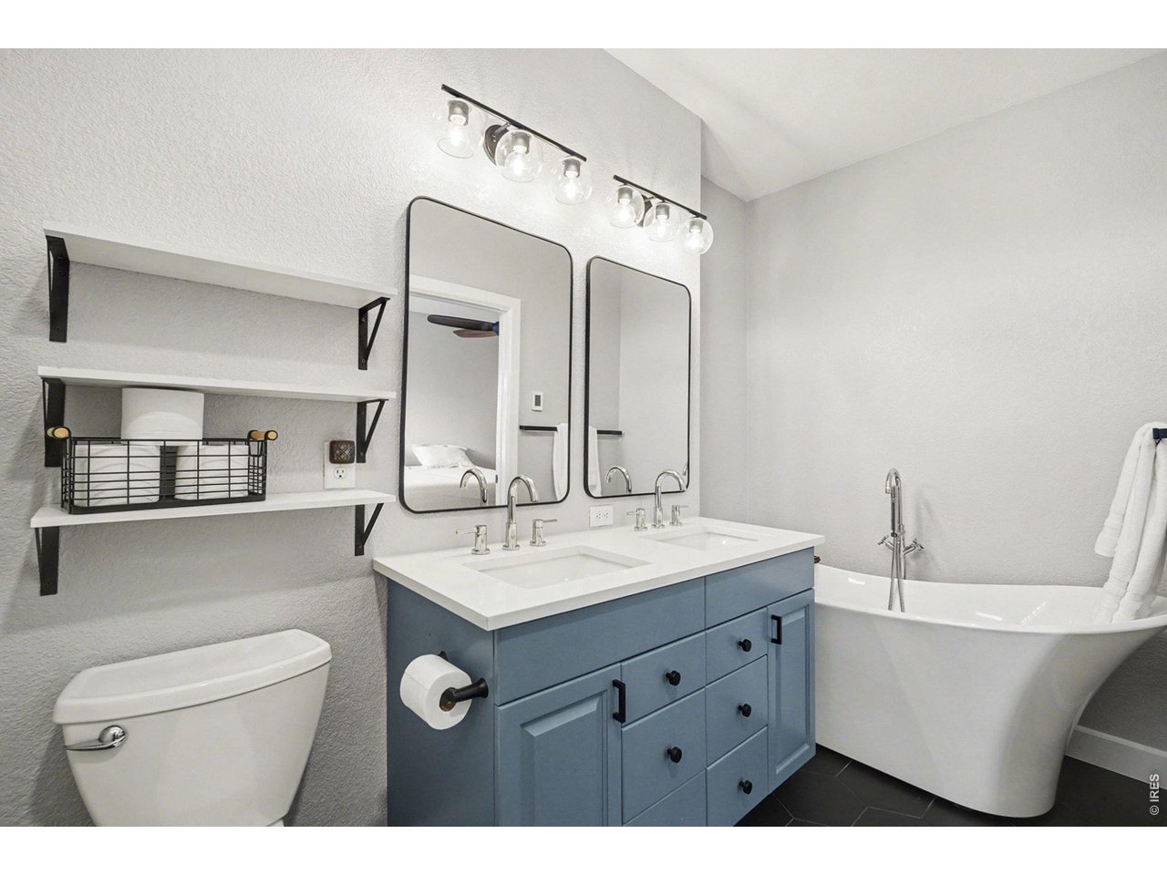 844 Cliffrose Way Severance, CO 80550 - Photo 20 of 50 a bathroom with a sink a toilet and a mirror