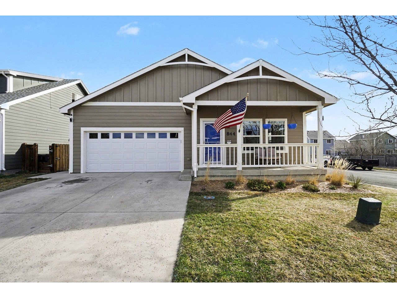 844 Cliffrose Way Severance, CO 80550 - Photo 2 of 50 a front view of a house with a yard