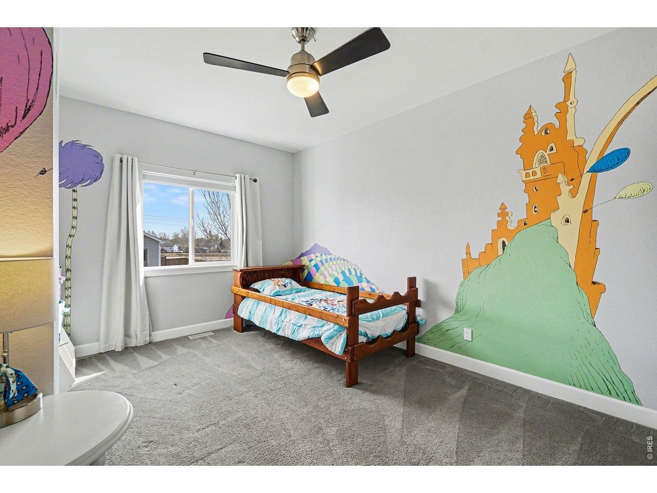 844 Cliffrose Way Severance, CO 80550 - Photo 22 of 50 a bedroom with a bed and a window