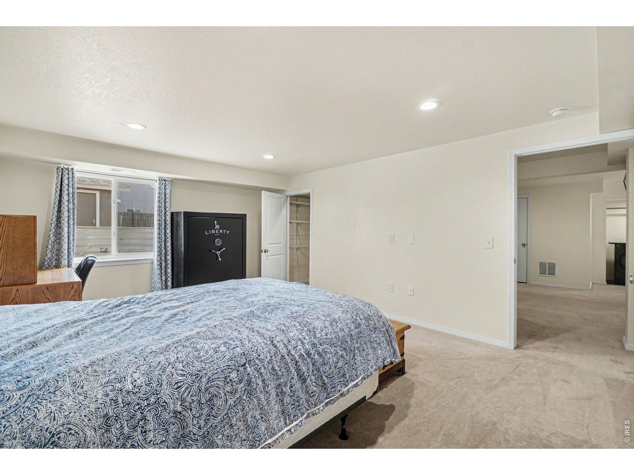 844 Cliffrose Way Severance, CO 80550 - Photo 26 of 50 a living room with a bed and dresser