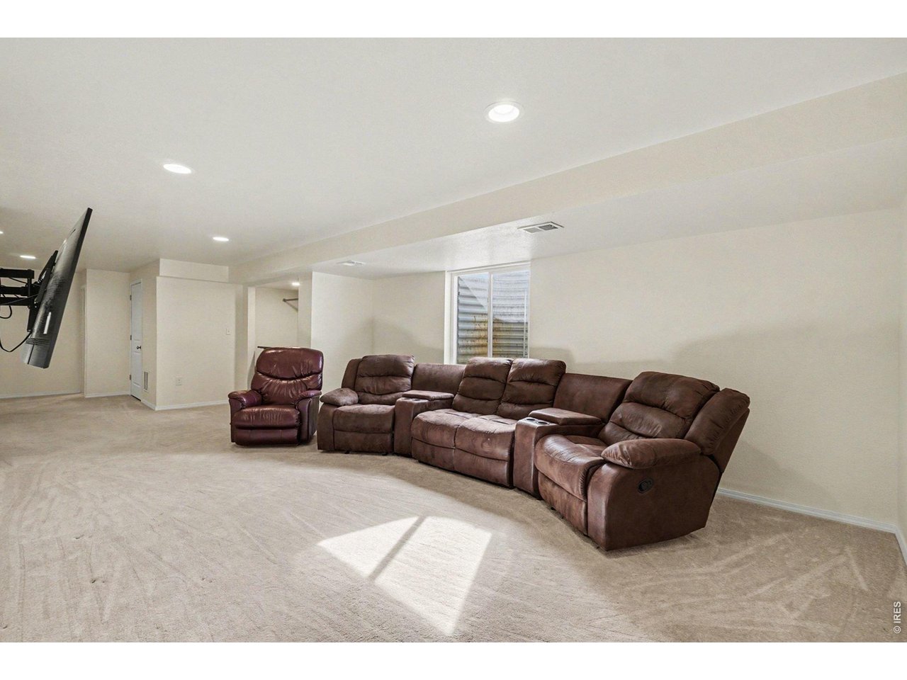 844 Cliffrose Way Severance, CO 80550 - Photo 33 of 50 a living room with furniture