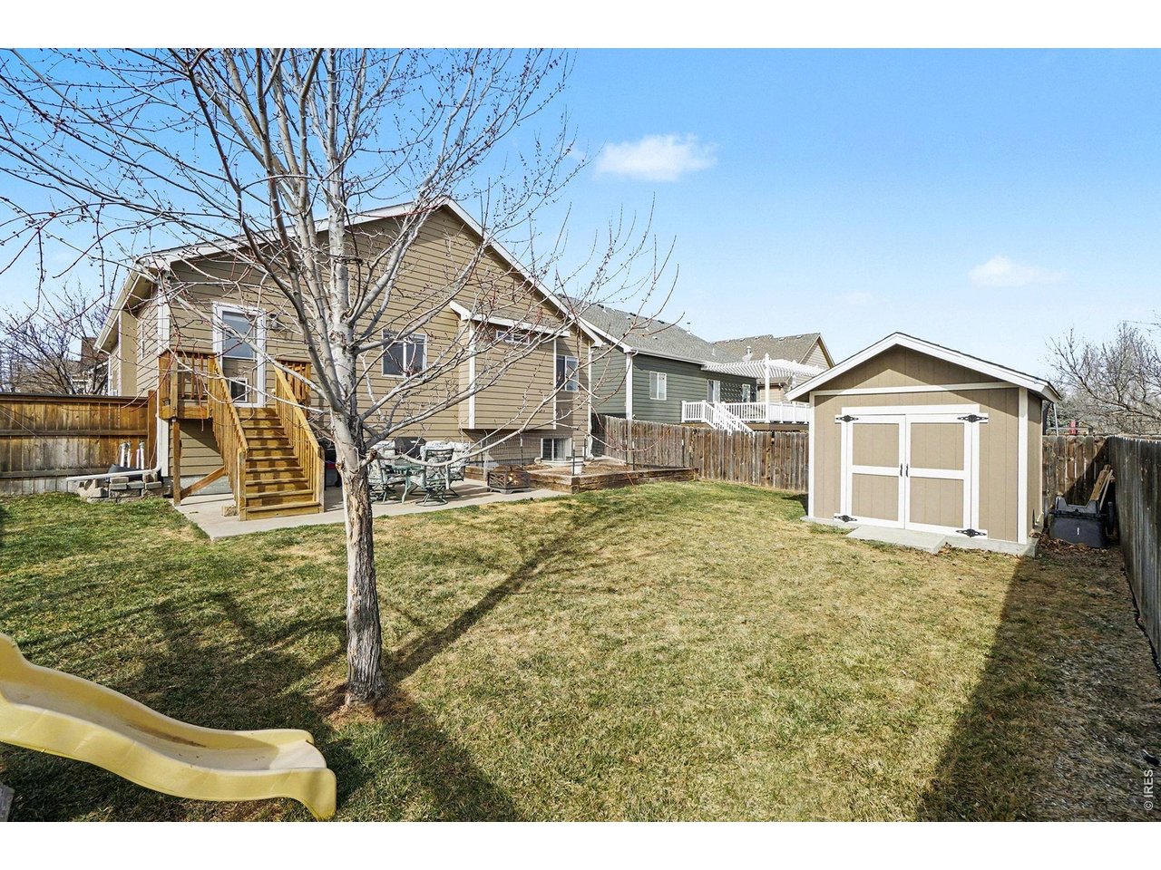 844 Cliffrose Way Severance, CO 80550 - Photo 37 of 50 a view of a house with a yard