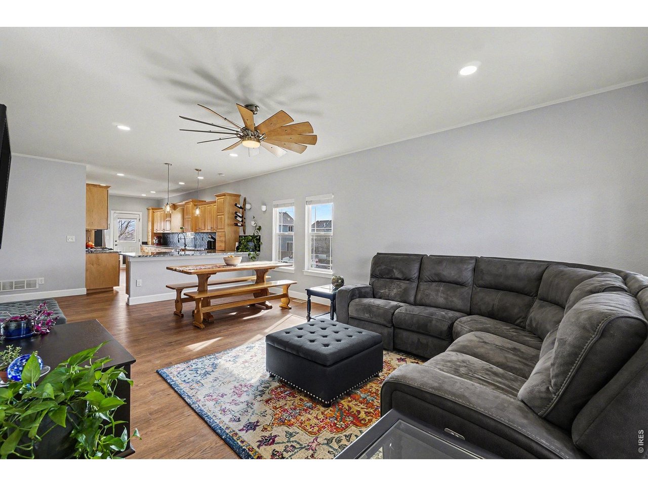 844 Cliffrose Way Severance, CO 80550 - Photo 6 of 50 a living room with furniture and a rug