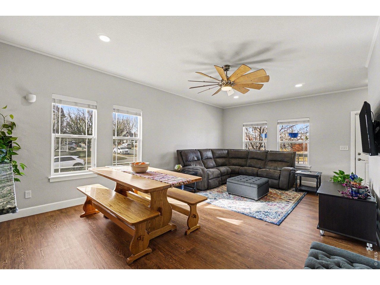 844 Cliffrose Way Severance, CO 80550 - Photo 7 of 50 a living room with furniture a flat screen tv and a table