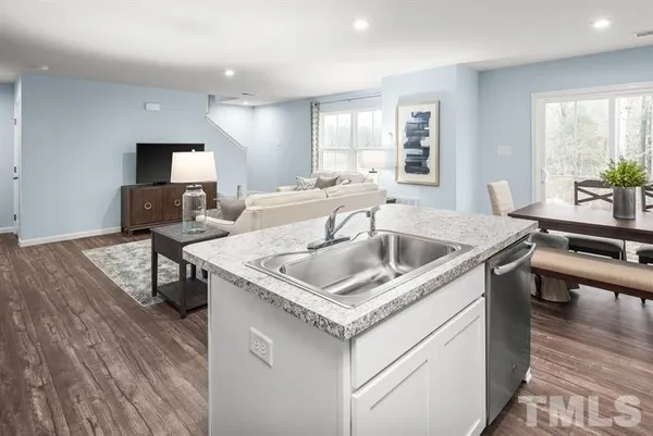 a kitchen with a sink a counter space and appliances