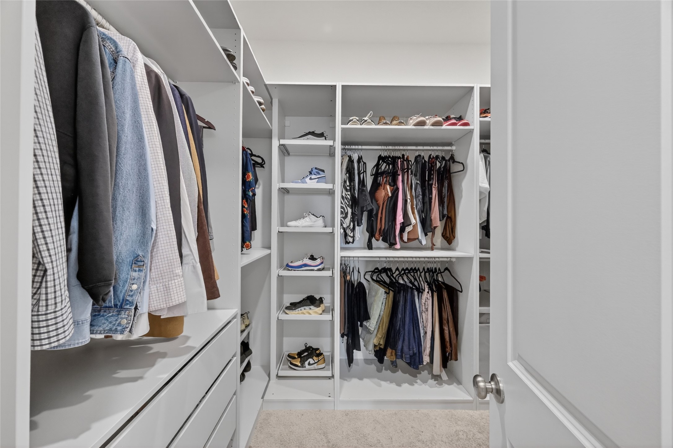 4439 Stone Ridge Lane Manvel, TX 77578 - Photo 28 of 48 a view of walk in closet with clothes and shoes