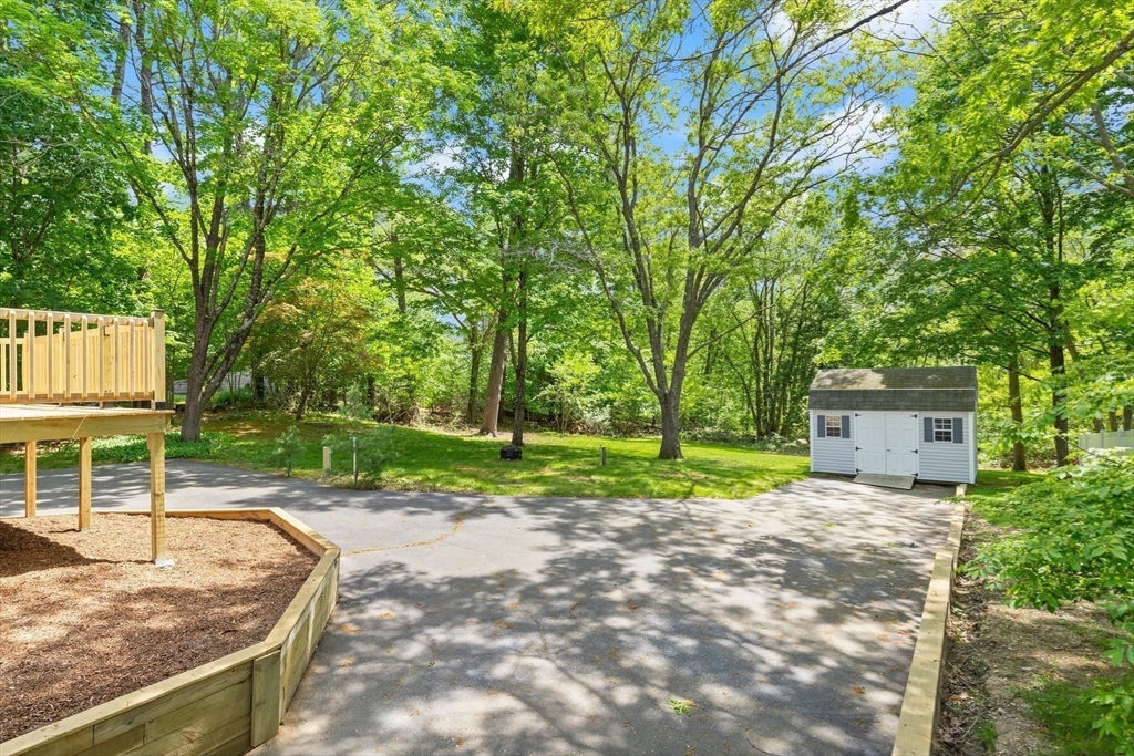 1049 Pleasant Street Canton, MA 02021 - Photo 16 of 16 a view of a backyard with a small house