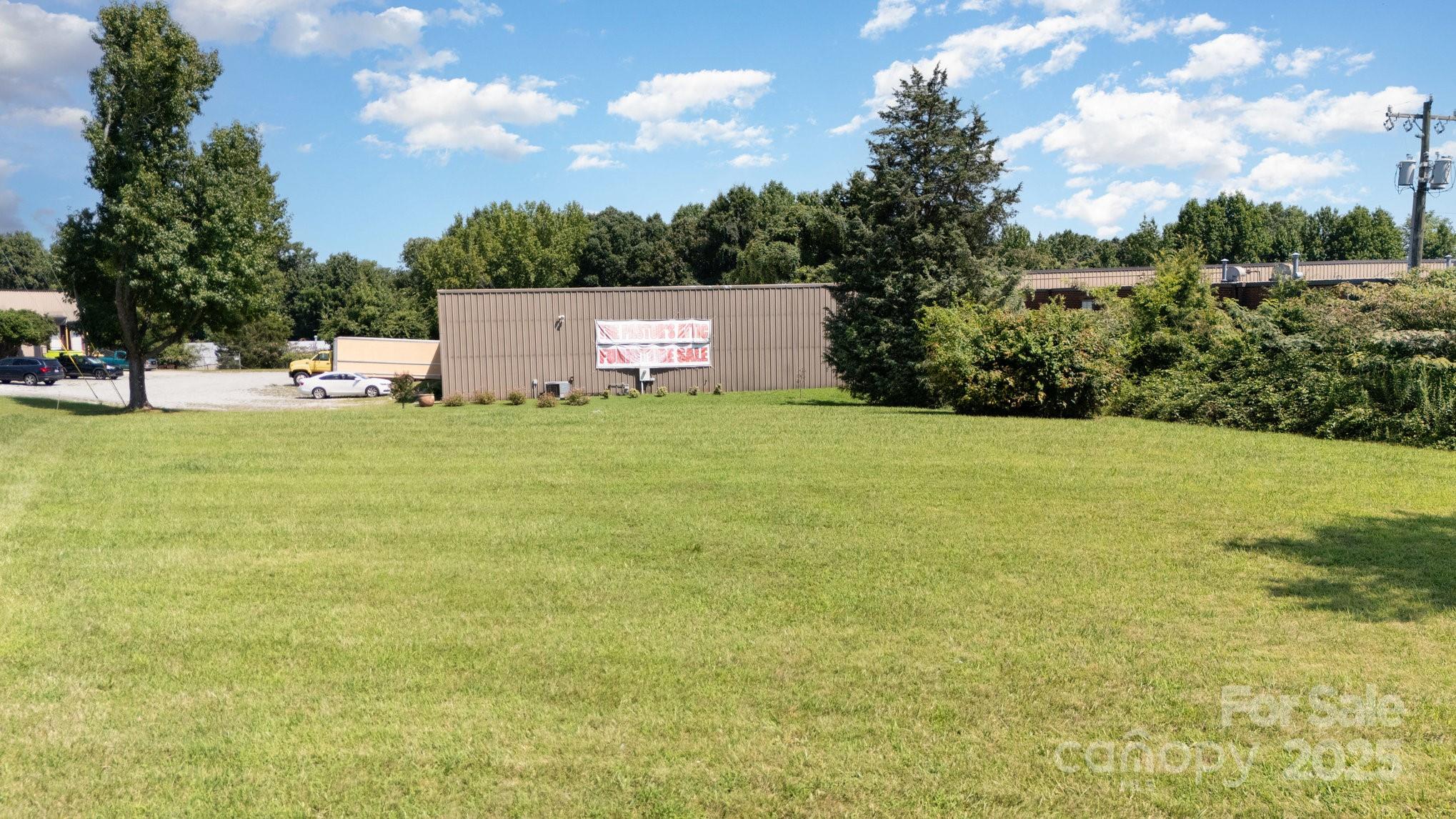 1300 Starr Drive High Point, NC 27260 - Photo 2 of 10 a view of a big yard with large trees