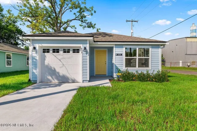 a front view of a house with garden