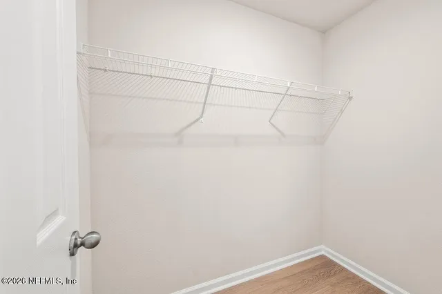 a view of a room with racks on the wall