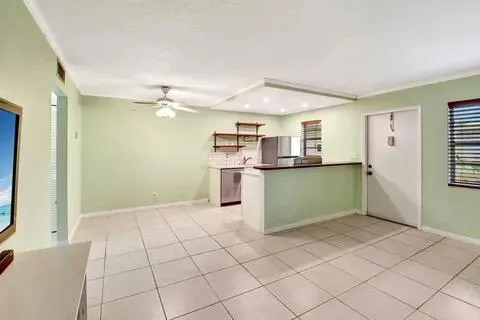 a kitchen with stainless steel appliances cabinets and window