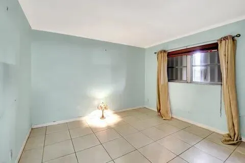 a view of an empty room and window