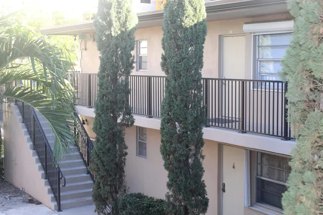 a balcony view with a garden space