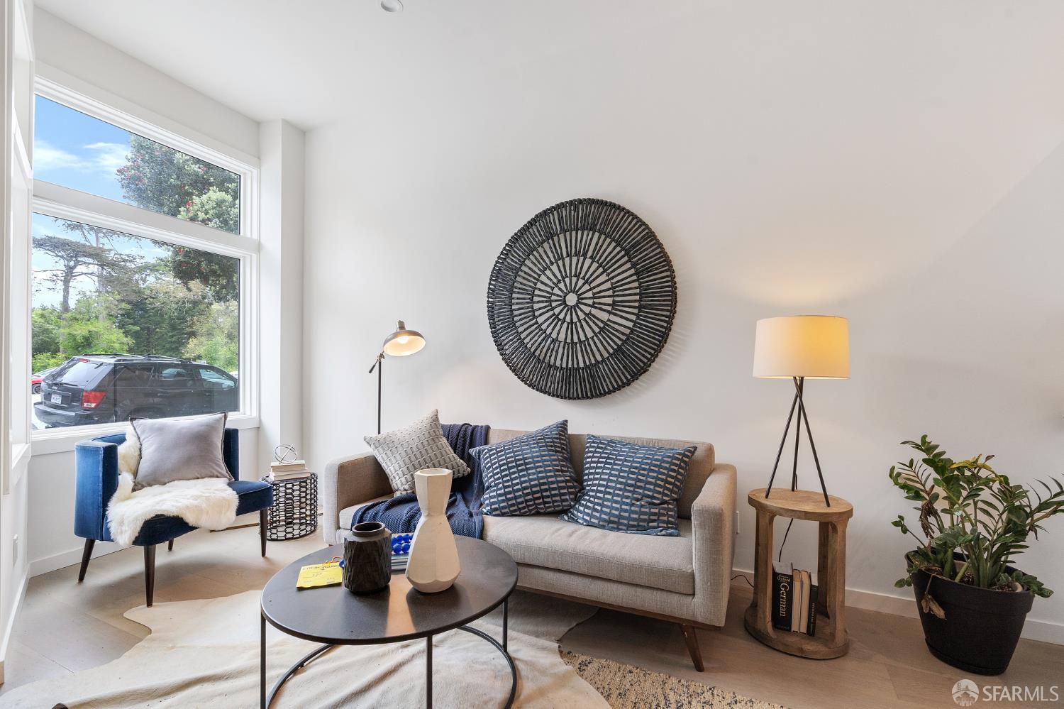 3036 Fulton Street, Unit 1 San Francisco, CA 94118 - Photo 2 of 13 a living room with furniture and a large window
