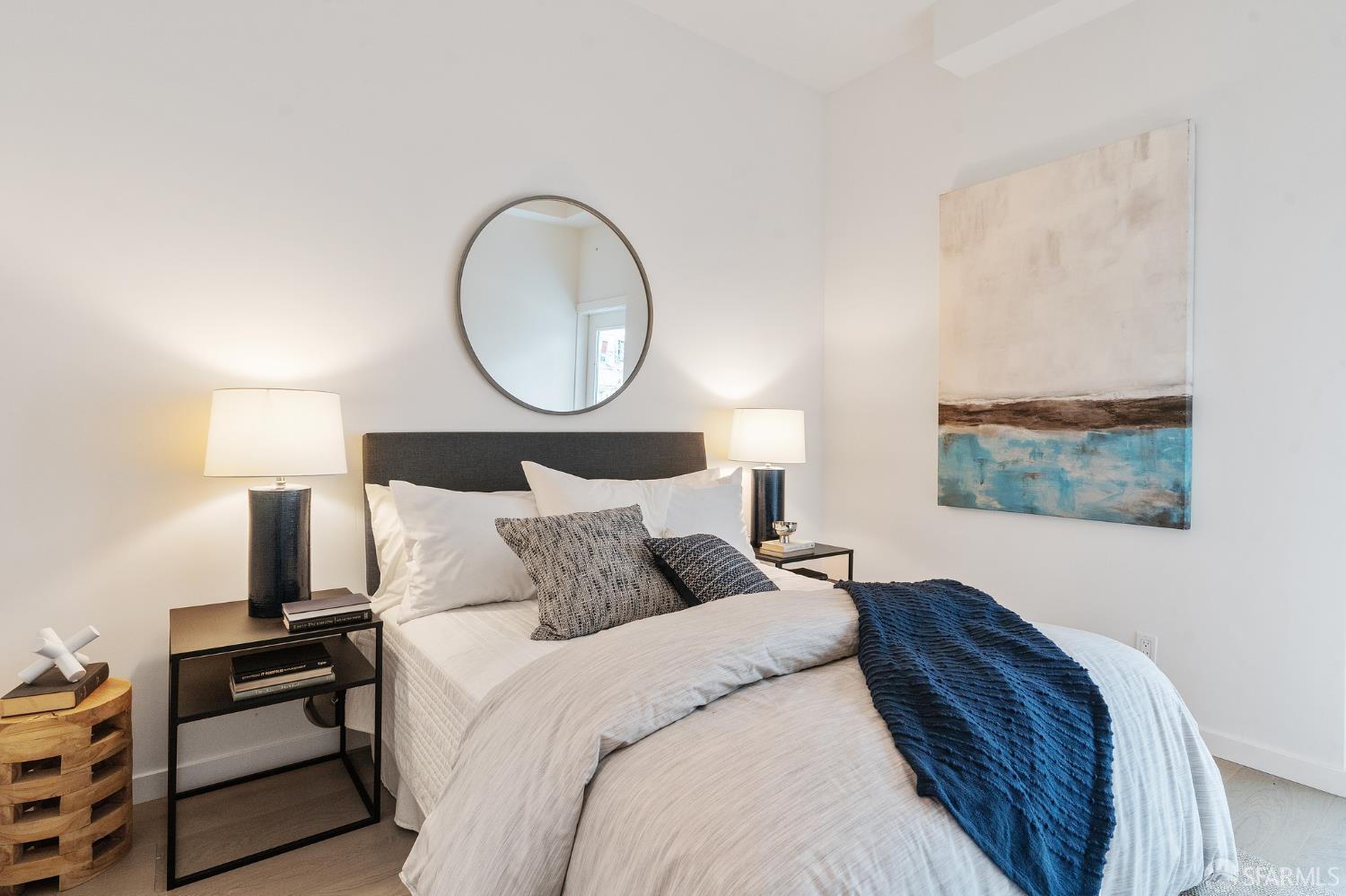 3036 Fulton Street, Unit 1 San Francisco, CA 94118 - Photo 8 of 13 a bedroom with a bed and a painting on the wall