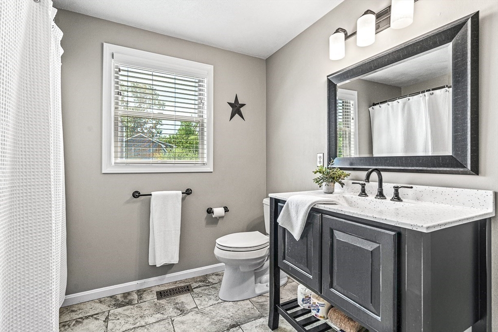 27 A Andrews Farm Road Boxford, MA 01921 - Photo 15 of 37 a spacious bathroom with a toilet sink and mirror