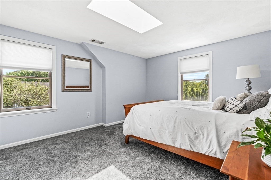 27 A Andrews Farm Road Boxford, MA 01921 - Photo 24 of 37 a bedroom with a bed lamp and window