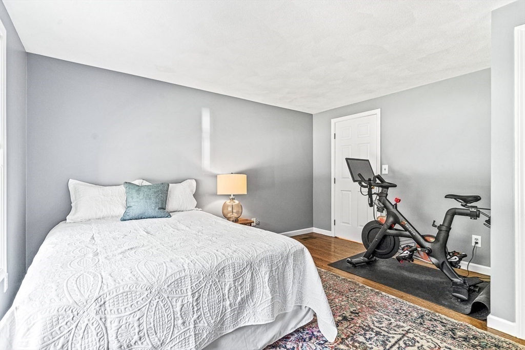 27 A Andrews Farm Road Boxford, MA 01921 - Photo 26 of 37 a bedroom with a bed and a table