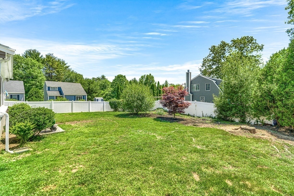 27 A Andrews Farm Road Boxford, MA 01921 - Photo 28 of 37 a backyard of a house with lots of green space