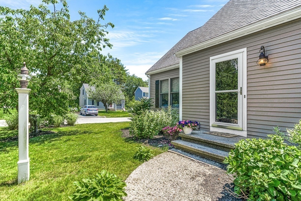 27 A Andrews Farm Road Boxford, MA 01921 - Photo 3 of 37 a front view of a house with garden