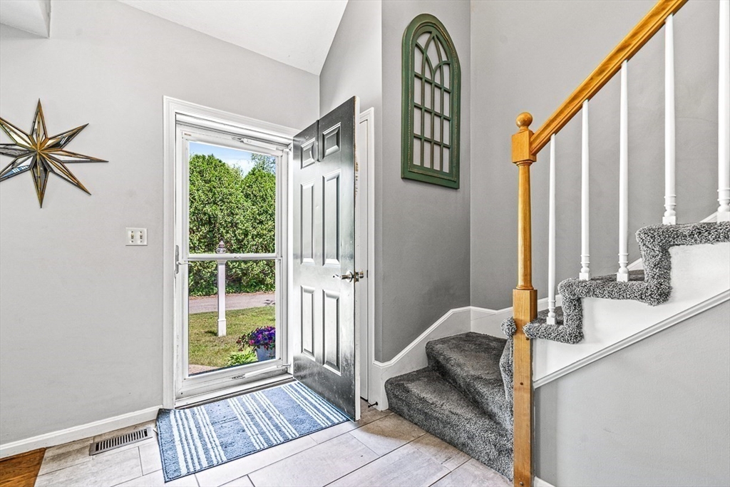 27 A Andrews Farm Road Boxford, MA 01921 - Photo 4 of 37 a view of an entryway with wooden floor and door