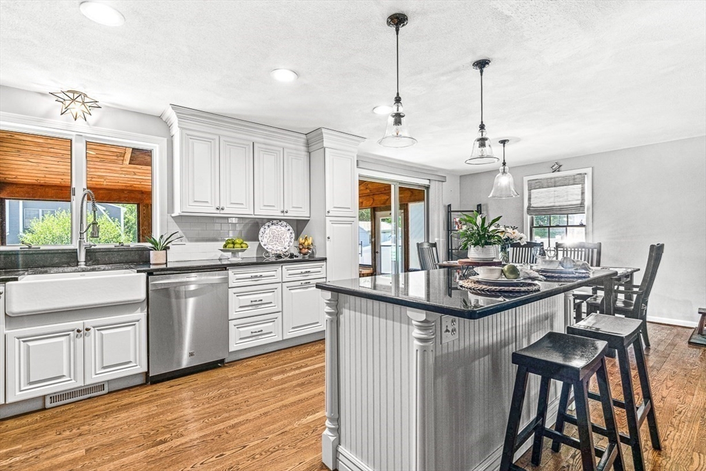 27 A Andrews Farm Road Boxford, MA 01921 - Photo 10 of 37 a kitchen with stainless steel appliances granite countertop a sink a stove and chairs