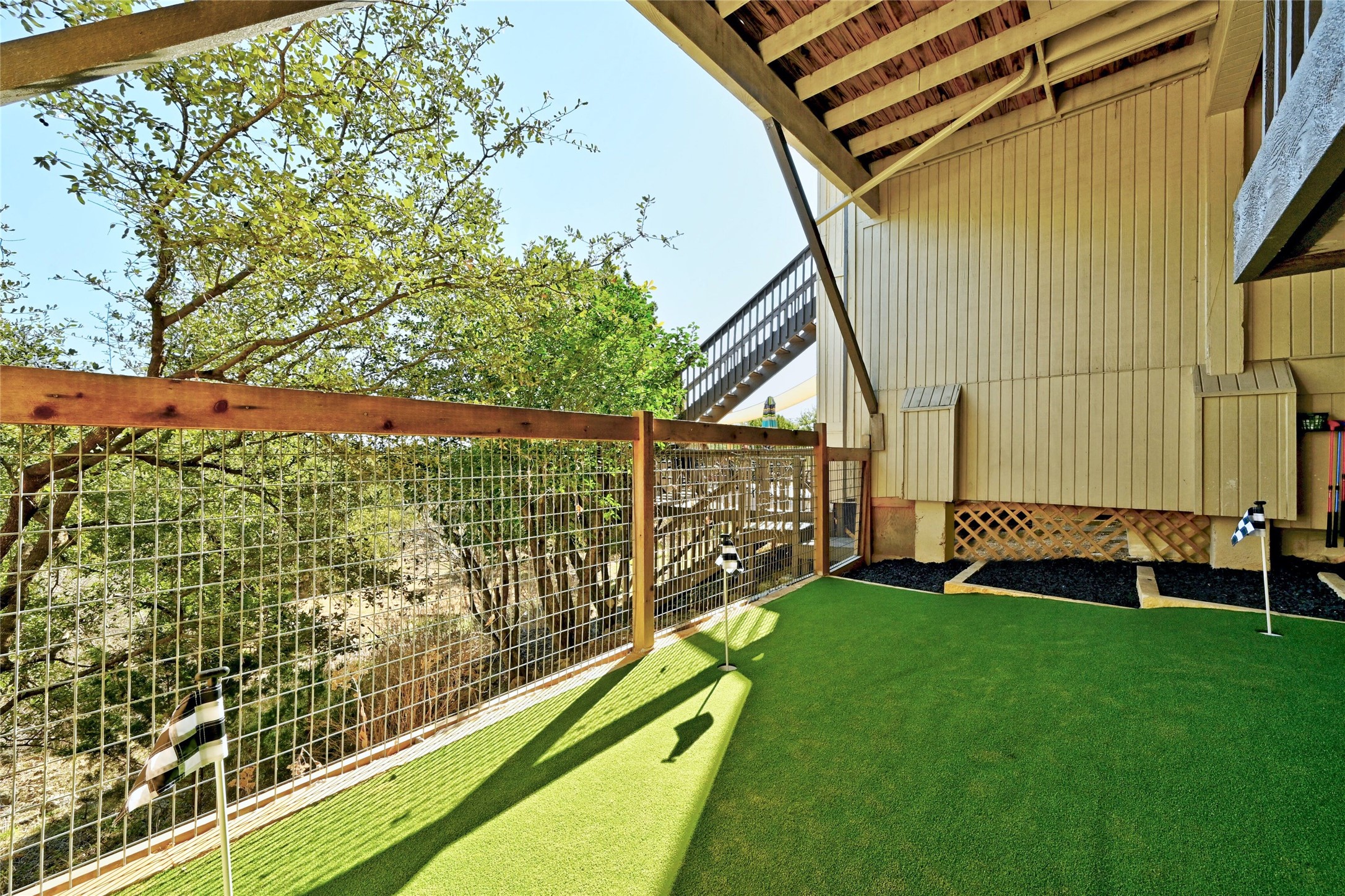 115 Comanche Drive Point Venture, TX 78645 - Photo 25 of 40 a view of a backyard with sitting area