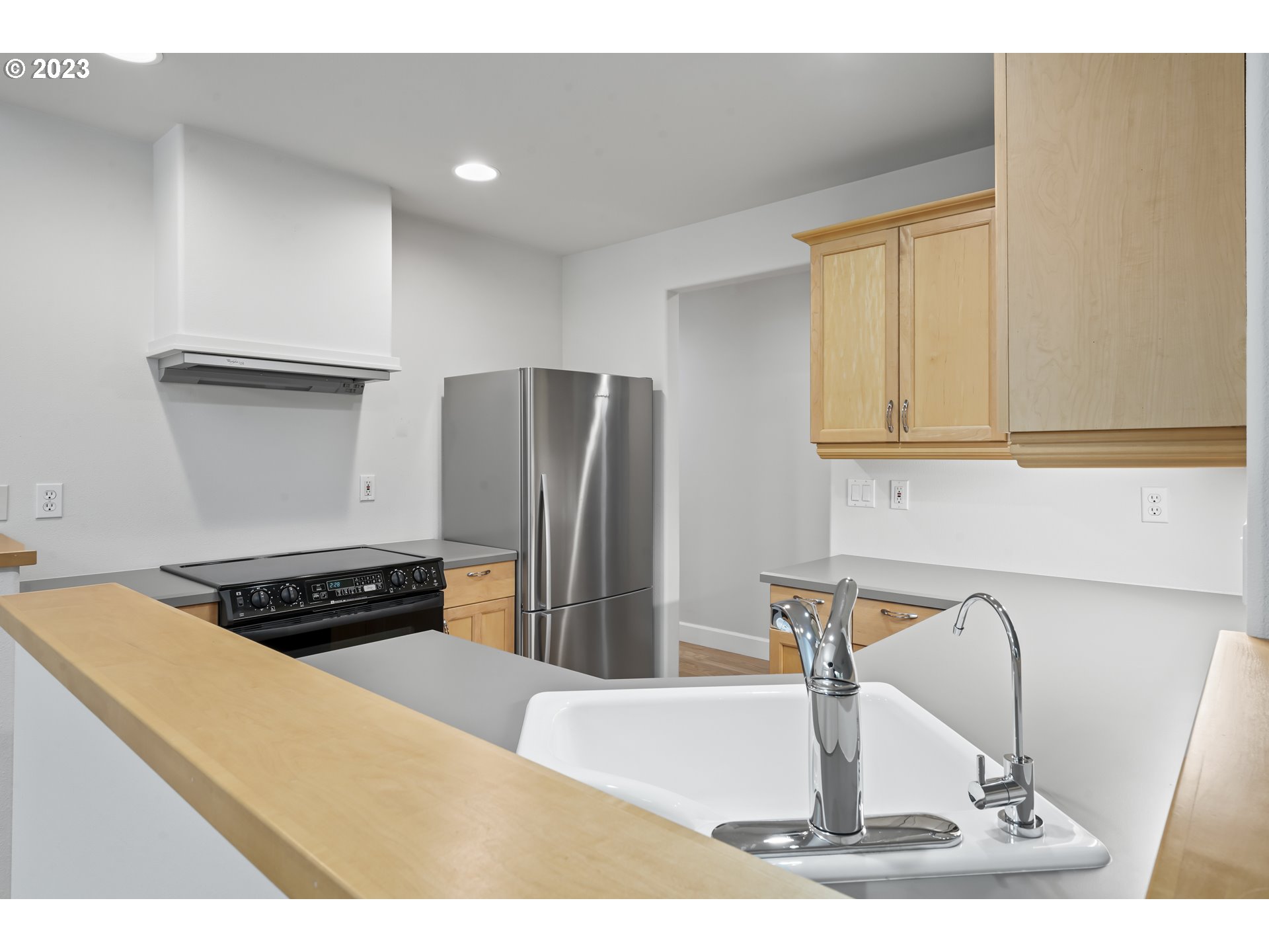 4 Waterford Downs Florence, OR 97439 - Photo 16 of 41 a kitchen with a refrigerator and a sink