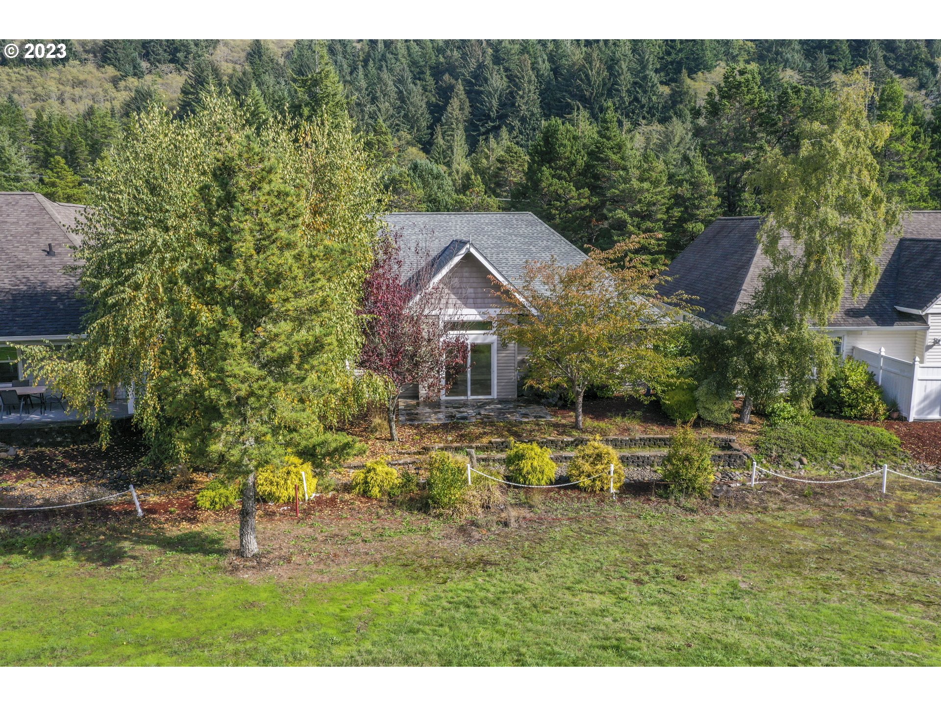 4 Waterford Downs Florence, OR 97439 - Photo 38 of 41 a aerial view of a house with swimming pool and garden