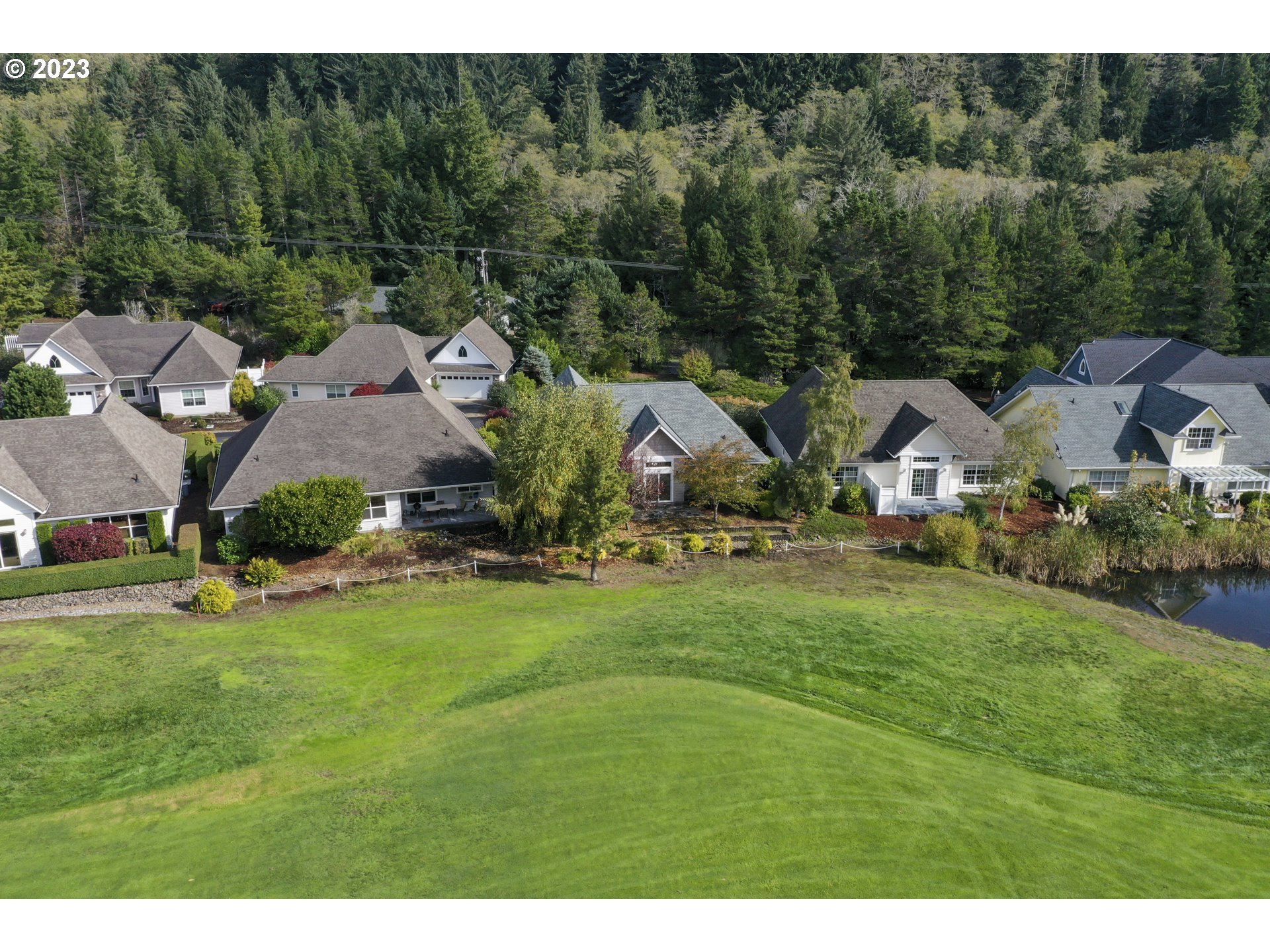 4 Waterford Downs Florence, OR 97439 - Photo 39 of 41 a aerial view of a house with yard and green space