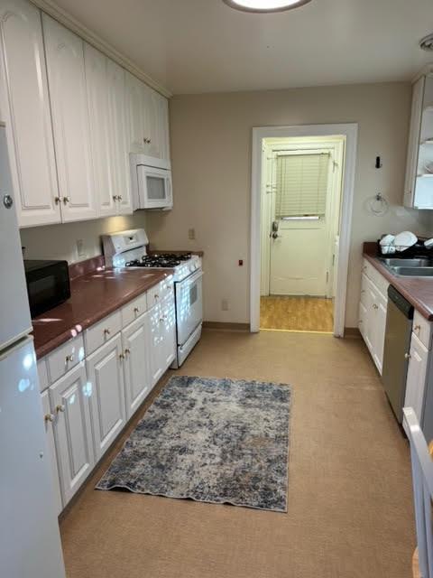 740 Locust Street Santa Clara, CA 95050 - Photo 11 of 15 a kitchen with stainless steel appliances granite countertop a stove a sink and a refrigerator