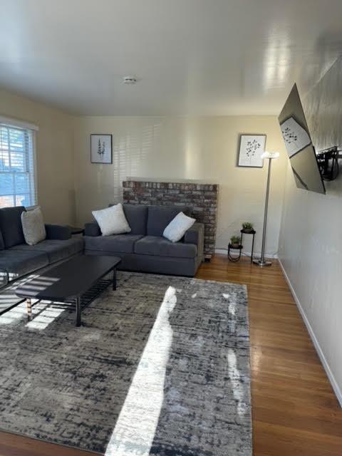 740 Locust Street Santa Clara, CA 95050 - Photo 4 of 15 a living room with furniture and a rug