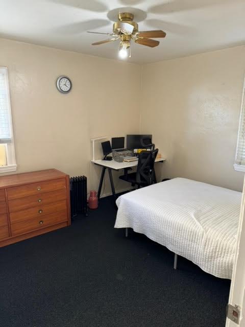 740 Locust Street Santa Clara, CA 95050 - Photo 5 of 15 a bedroom with a bed and a chandelier