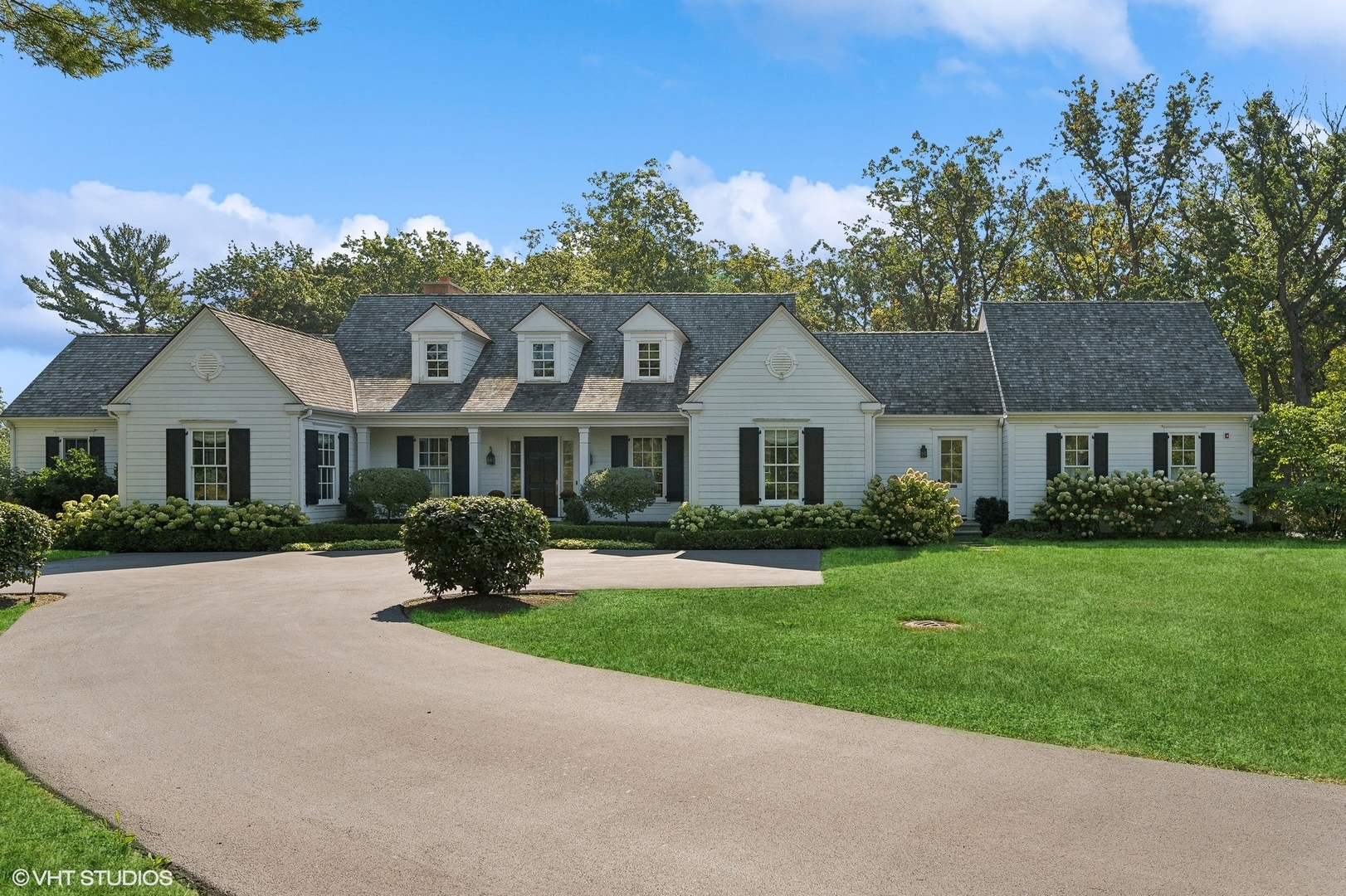 Undisclosed Address Lake Bluff, IL 60044 - Photo 1 of 51 a front view of a house with a garden